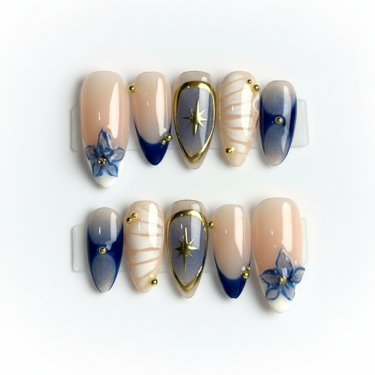 Set of decorative nails with blue and gold designs on a white background