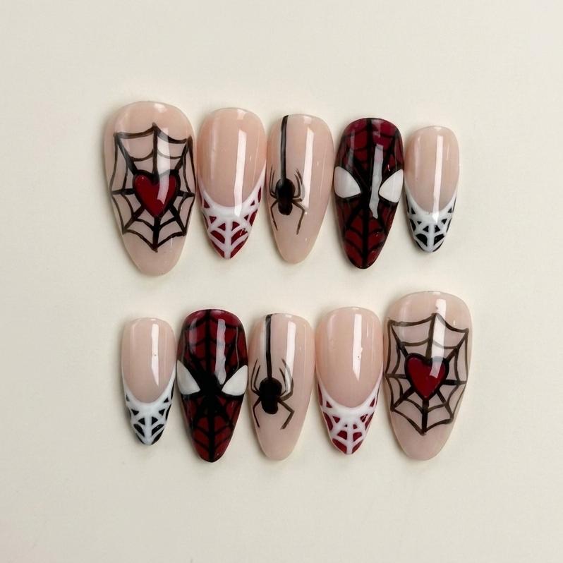 Set of Halloween-themed nail art designs on a beige background