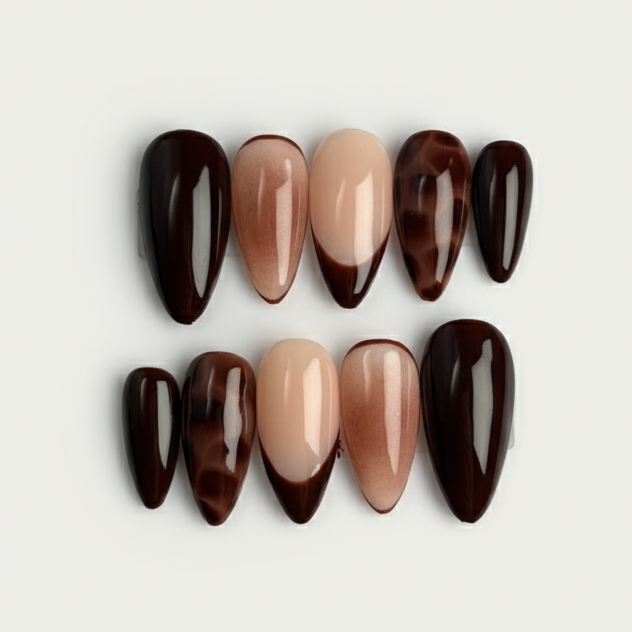 Set of brown and beige nail polish bottles on a light gray background